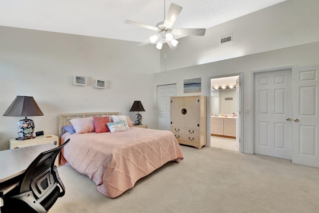 4059 Gator Trace Rd, Fort Pierce, FL 34982 - bedroom with light colored carpet, connected bathroom, high vaulted ceiling, and a ceiling fan