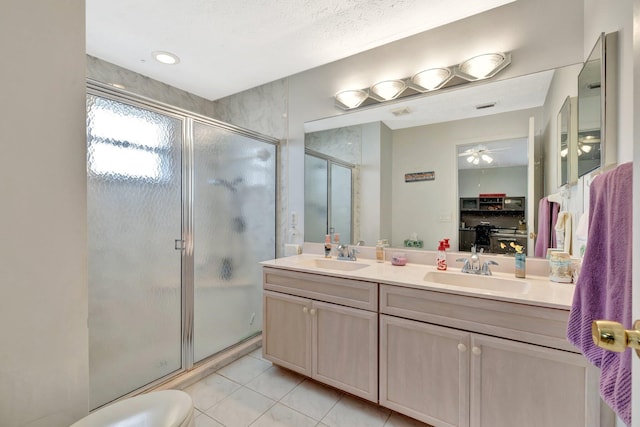 4059 Gator Trace Rd, Fort Pierce, FL 34982 - full bathroom featuring a stall shower, double vanity, and ceiling fan