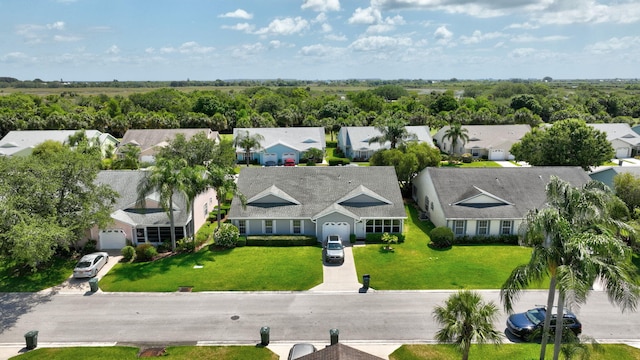 birds eye view of property with a residential view