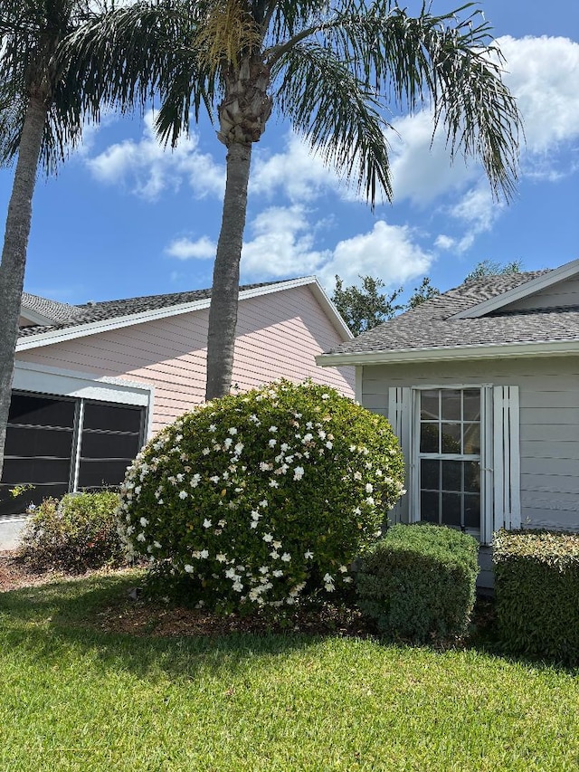 4059 Gator Trace Rd, Fort Pierce, FL 34982 - view of side of home with a yard and an attached garage