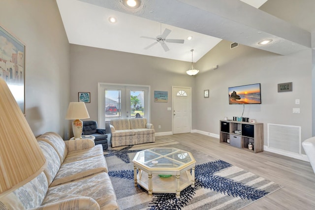 4059 Gator Trace Rd, Fort Pierce, FL 34982 - living area with baseboards, light wood-style flooring, ceiling fan, french doors, and high vaulted ceiling