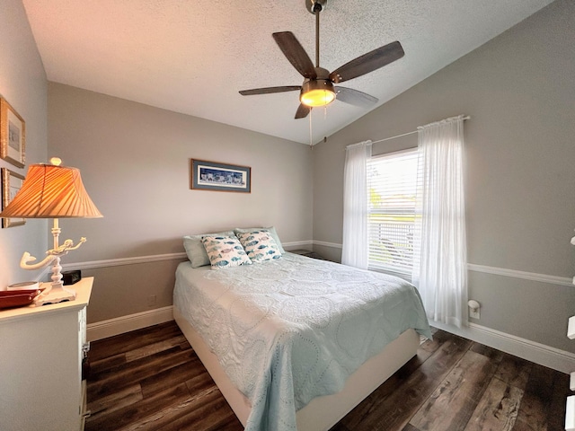 6446 Terra Rosa Cir, Boynton Beach, FL 33472 - bedroom with wood finished floors, lofted ceiling, a textured ceiling, baseboards, and a ceiling fan