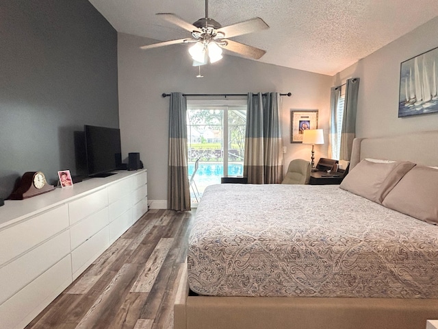 6446 Terra Rosa Cir, Boynton Beach, FL 33472 - bedroom with lofted ceiling, dark wood-type flooring, access to exterior, a ceiling fan, and a textured ceiling