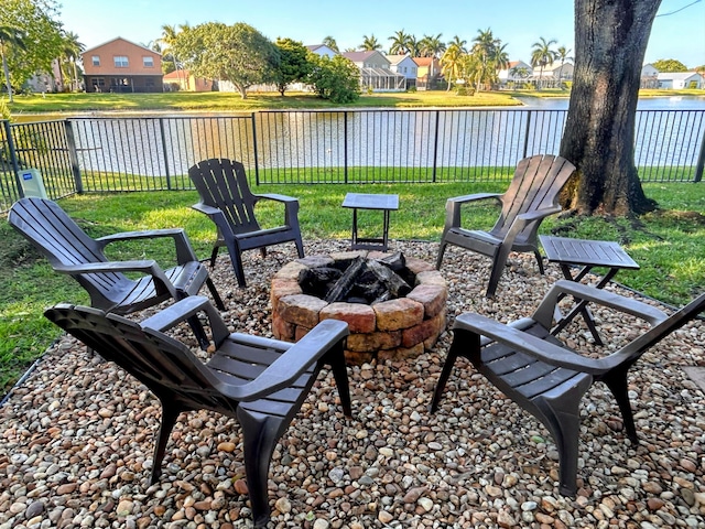 6446 Terra Rosa Cir, Boynton Beach, FL 33472 - view of patio with an outdoor fire pit, a residential view, and a water view