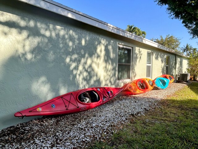 6446 Terra Rosa Cir, Boynton Beach, FL 33472 - view of side of home featuring central AC and stucco siding