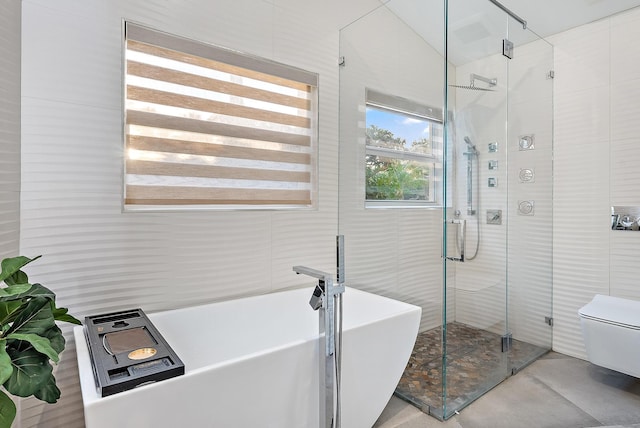 full bath with a freestanding tub, a stall shower, and vaulted ceiling