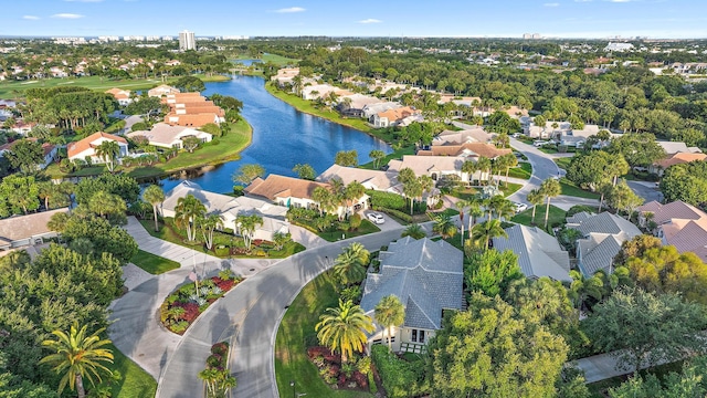 bird's eye view with a water view and a residential view