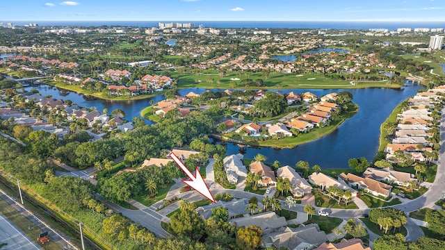 bird's eye view featuring a residential view, a water view, and golf course view