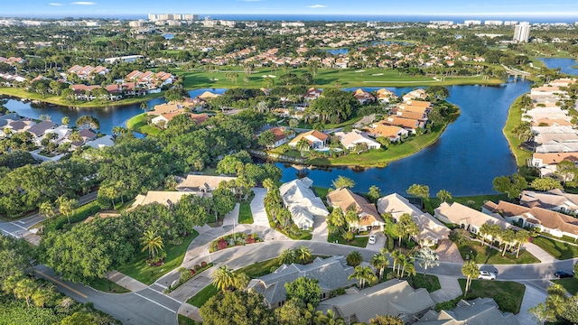 birds eye view of property featuring a water view, view of golf course, and a residential view