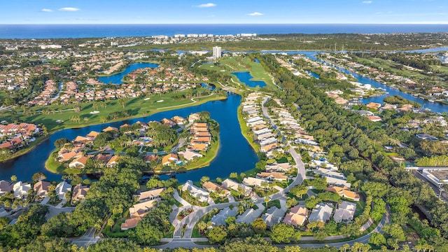 birds eye view of property featuring a water view and a residential view