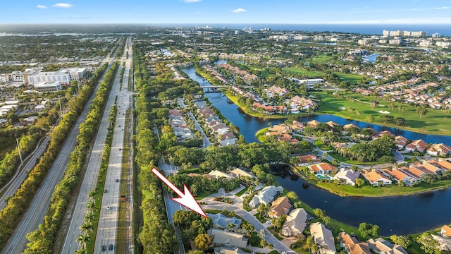 birds eye view of property featuring a residential view and a water view