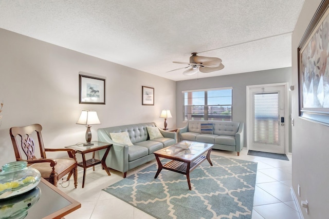4049 Wolverton C, Boca Raton, FL 33434 - living area with a ceiling fan, a textured ceiling, and light tile patterned floors