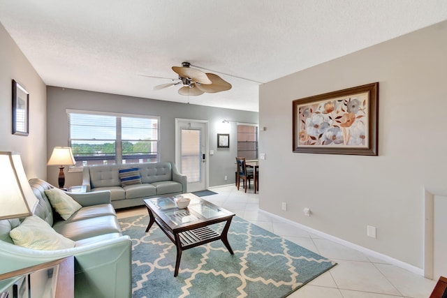 4049 Wolverton C, Boca Raton, FL 33434 - living area with light tile patterned flooring, a ceiling fan, and a textured ceiling