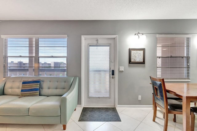 4049 Wolverton C, Boca Raton, FL 33434 - entryway with light tile patterned floors and baseboards