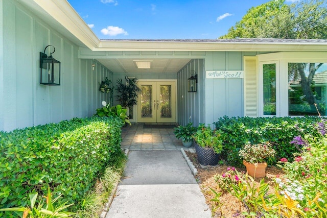 property entrance featuring french doors and board and batten siding