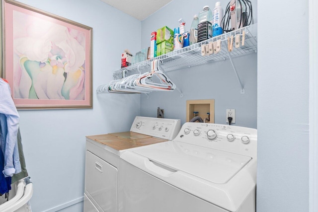 laundry area with laundry area and washing machine and clothes dryer