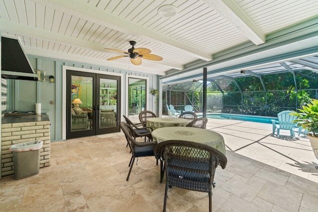 view of patio featuring an outdoor pool, french doors, a ceiling fan, glass enclosure, and outdoor dining space