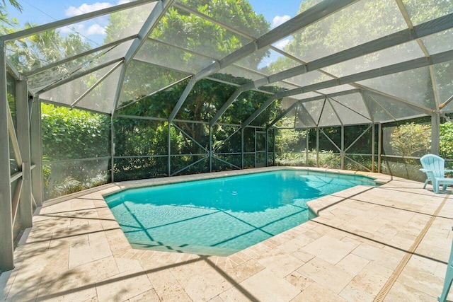 pool with a patio and a lanai