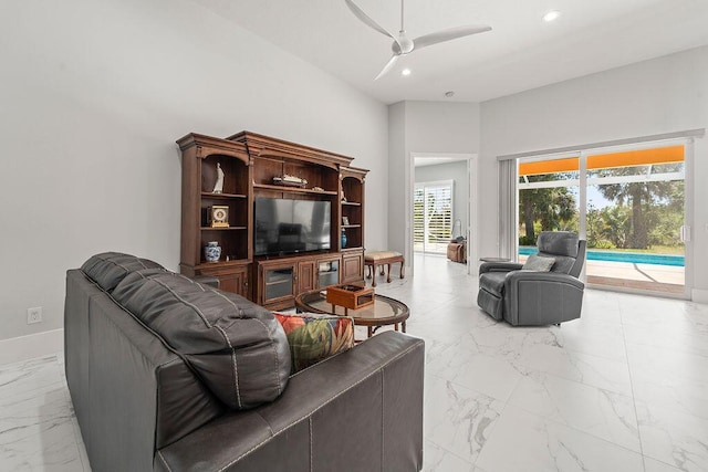 3352 SE Cascadia Way, Hobe Sound, FL 33455 - living area featuring ceiling fan, marble finish floor, recessed lighting, baseboards, and a towering ceiling