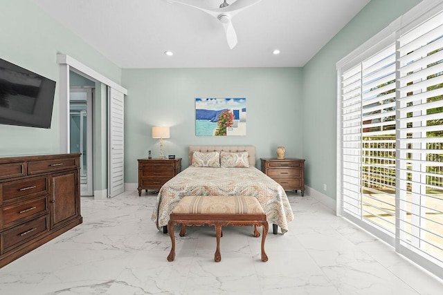 3352 SE Cascadia Way, Hobe Sound, FL 33455 - bedroom featuring baseboards, ceiling fan, marble finish floor, and a closet