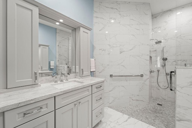 3352 SE Cascadia Way, Hobe Sound, FL 33455 - full bathroom with a marble finish shower, vanity, and marble finish floor