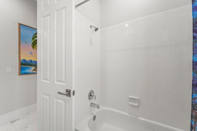 3352 SE Cascadia Way, Hobe Sound, FL 33455 - full bathroom with baseboards, marble finish floor, and shower / tub combo
