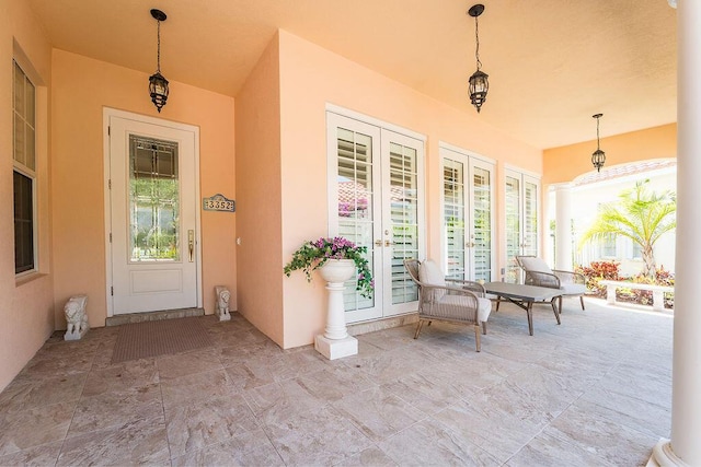 3352 SE Cascadia Way, Hobe Sound, FL 33455 - exterior space featuring french doors, covered porch, and stucco siding
