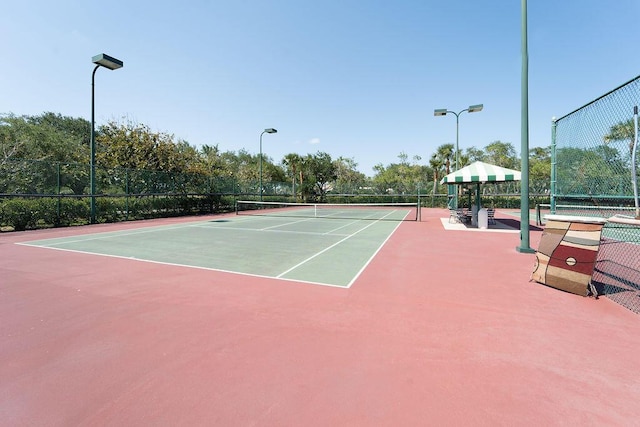 3352 SE Cascadia Way, Hobe Sound, FL 33455 - view of tennis court featuring fence and community basketball court