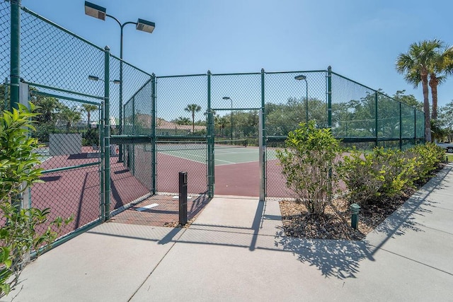 3352 SE Cascadia Way, Hobe Sound, FL 33455 - view of tennis court with fence