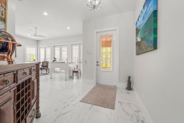 3352 SE Cascadia Way, Hobe Sound, FL 33455 - foyer with baseboards, a notable chandelier, recessed lighting, and marble finish floor