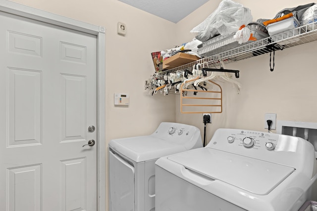 clothes washing area with laundry area and independent washer and dryer