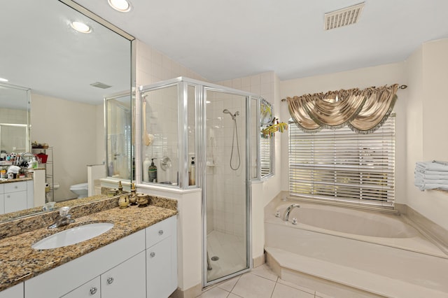 bathroom with a stall shower, tile patterned flooring, vanity, and visible vents