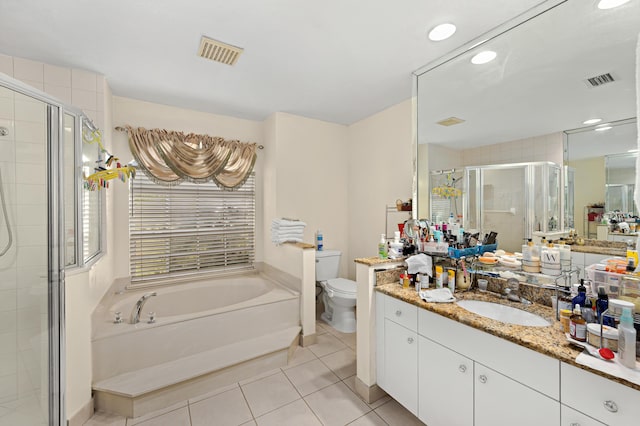 bathroom featuring toilet, a shower stall, visible vents, and tile patterned floors