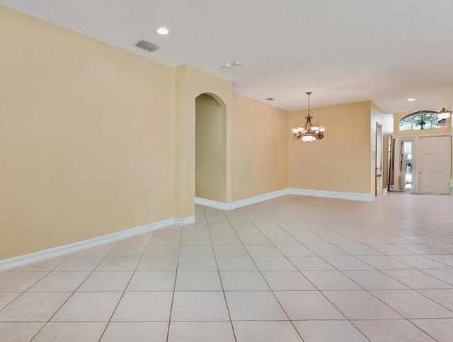 7562 Starfish Reef Ln, Lake Worth, FL 33467 - spare room featuring a chandelier, light tile patterned floors, arched walkways, baseboards, and recessed lighting