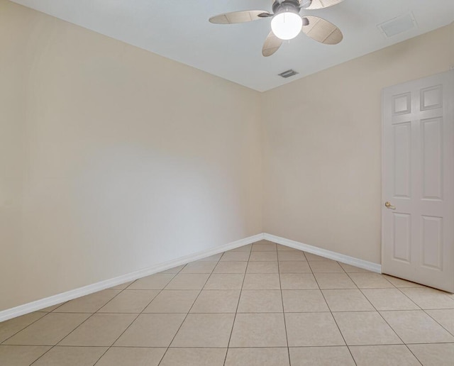 7562 Starfish Reef Ln, Lake Worth, FL 33467 - spare room featuring ceiling fan, light tile patterned floors, and baseboards