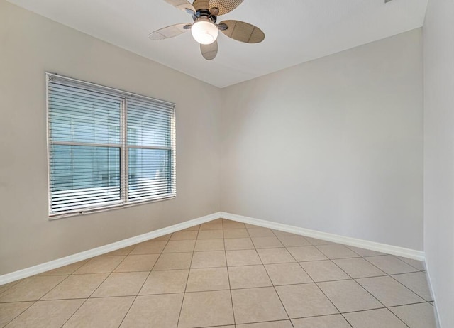 7562 Starfish Reef Ln, Lake Worth, FL 33467 - unfurnished room with a ceiling fan, light tile patterned flooring, and baseboards