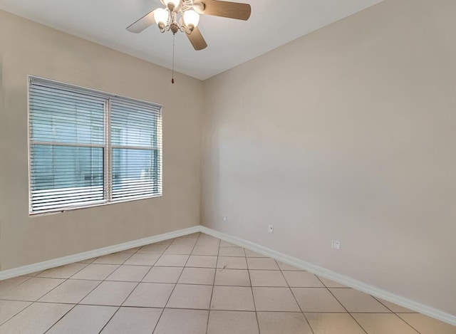 7562 Starfish Reef Ln, Lake Worth, FL 33467 - spare room with ceiling fan, light tile patterned floors, and baseboards
