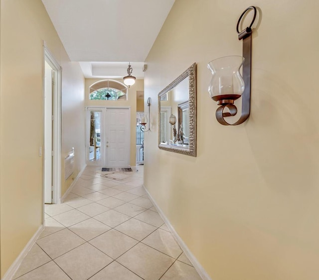 7562 Starfish Reef Ln, Lake Worth, FL 33467 - corridor with light tile patterned floors and baseboards