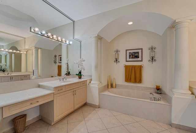 7562 Starfish Reef Ln, Lake Worth, FL 33467 - full bathroom featuring decorative columns, a garden tub, tile patterned floors, and vanity