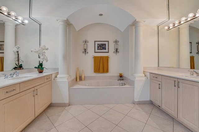 7562 Starfish Reef Ln, Lake Worth, FL 33467 - full bath with decorative columns, two vanities, a garden tub, and tile patterned floors