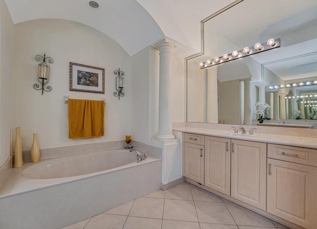 7562 Starfish Reef Ln, Lake Worth, FL 33467 - full bathroom featuring ornate columns, a bath, vanity, vaulted ceiling, and tile patterned floors