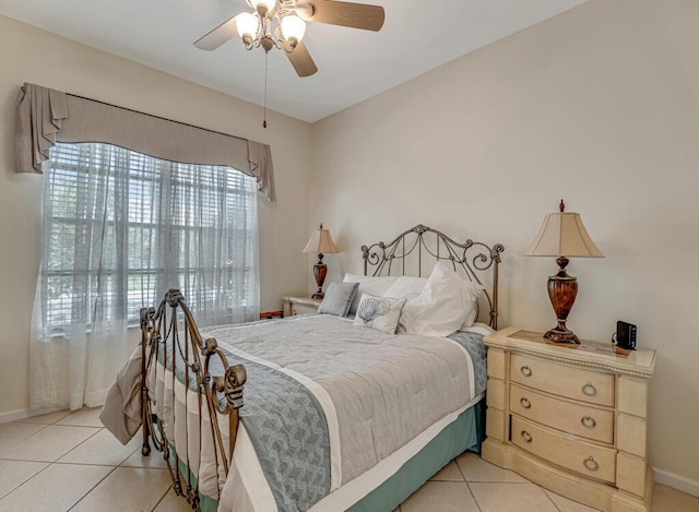 7562 Starfish Reef Ln, Lake Worth, FL 33467 - bedroom with light tile patterned floors, baseboards, and a ceiling fan