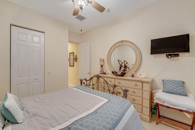 7562 Starfish Reef Ln, Lake Worth, FL 33467 - bedroom with a closet, a ceiling fan, and light tile patterned floors