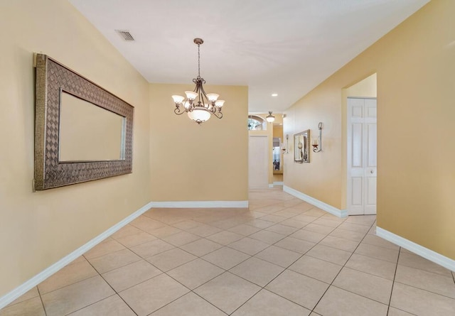 7562 Starfish Reef Ln, Lake Worth, FL 33467 - empty room with a chandelier, light tile patterned flooring, baseboards, and recessed lighting