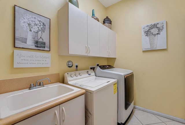 7562 Starfish Reef Ln, Lake Worth, FL 33467 - laundry room with cabinet space, separate washer and dryer, light tile patterned flooring, and baseboards
