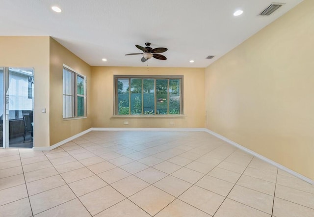 7562 Starfish Reef Ln, Lake Worth, FL 33467 - spare room featuring a ceiling fan, recessed lighting, light tile patterned floors, and baseboards
