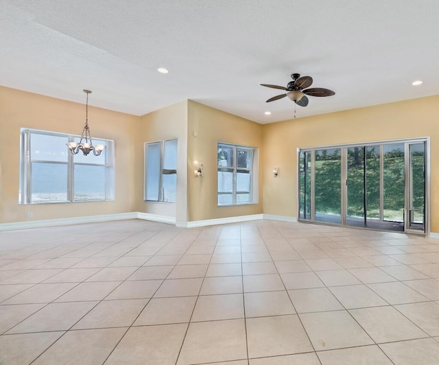 7562 Starfish Reef Ln, Lake Worth, FL 33467 - unfurnished room with baseboards, a chandelier, ceiling fan, recessed lighting, and light tile patterned floors