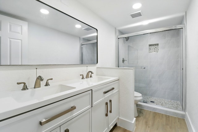 3107 SW 20th Ter Unit C-1, Delray Beach, FL 33445 - full bathroom with visible vents, wood finished floors, a stall shower, and a sink