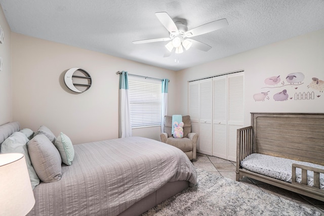 582 Cypress Green Cir, Wellington, FL 33414 - tiled bedroom featuring a ceiling fan and a closet