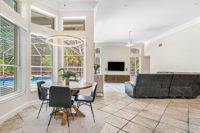 582 Cypress Green Cir, Wellington, FL 33414 - dining room with a ceiling fan, visible vents, ornamental molding, and plenty of natural light